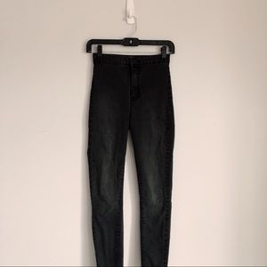 High-waisted black skinny jeans